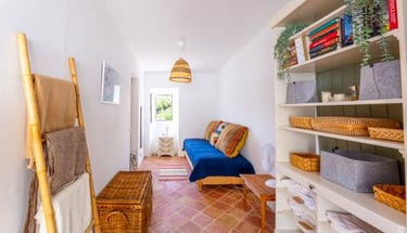 a room with a couch and a ladder