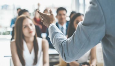 17+ years experienced Instructor giving training to students in a class room