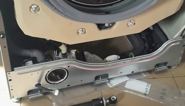 LG front load washer with base panel removed for damper replacement to resolve excessive vibration d