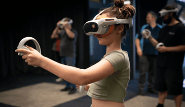 Young girl wearing a VR headset and holding VR controllers playing VR games
