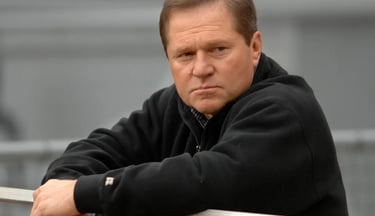 Scott Boras, MLB Super Agent, sitting at a conference.