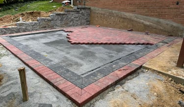 "Stone patio design by Profaster Services for outdoor spaces in Des Moines."