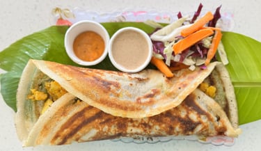 Masala dosa filled with spiced potato, served fresh at Aroha Dosas