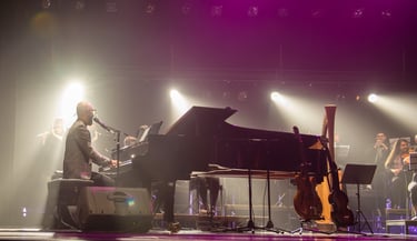David De Mata playing a piano in a concert
