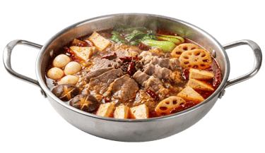 Steaming bowl of spicy Sichuan mala hotpot broth with floating red chilies and traditional peppercorns.