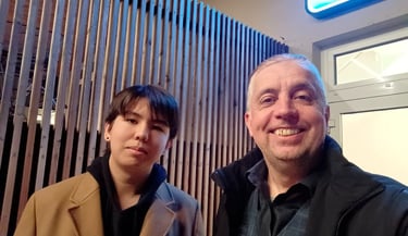 a man and a son standing next to each other