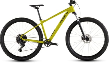 Side profile of a bright yellow Cube hardtail mountain bike with Shimano components and suspension fork.