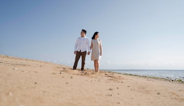 Wide beach portrait of intimate proposal couple at Sofitel Nusa Dua Bali