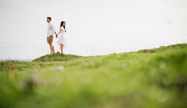 Couple proposal moment on a cliff at Melasti Beach Bali with ocean view