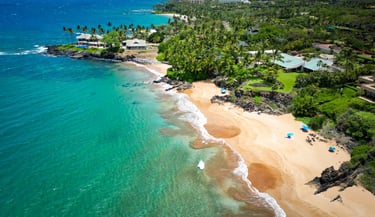 a beach with a sandy beach and a blue sky