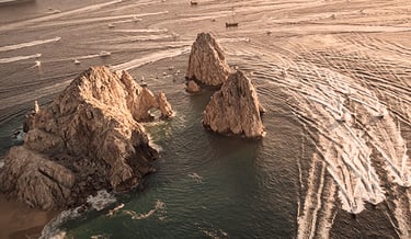 a boat traveling through the ocean with a boat in the water