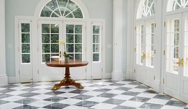 a room with a table and chairs and a table