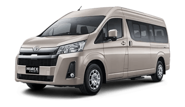 Gambar Toyota Hiace Premio warna beige pintu geser menggunakan velg Aloy pandangan dari kiri depan.