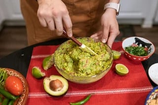 mixing-guacamole-dip-in-large-bowl