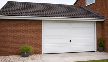 Completed garage conversion with new insulated garage door and finished exterior on Brighton home