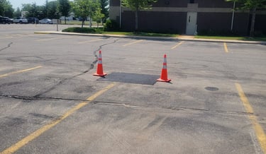 asphalt-repair-in-a-parking-lot.jpg