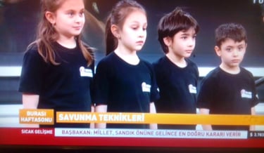 a television screen showing a group of children