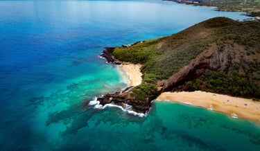a beach with a sandy beach and a blue sky