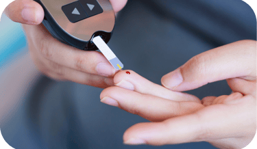a person holding a POCT meter in their hand
