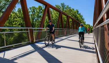 Cyclists riding across a bridge on the Louisville Loop in Kentucky
