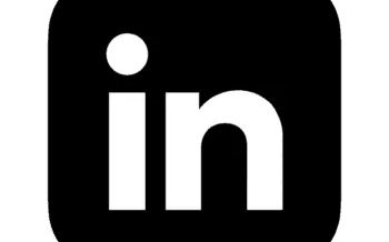 White LinkedIn logo icon on a black background for professional social media networking.