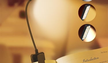 LED clip-on book light for reading in bed with adjustable brightness and warm white color modes.