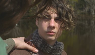 a man in a scarf around his neck