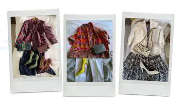 Capsule wardrobe flat lay with linen trousers, silk scarf, and blazer