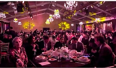 a large group of people sitting at a table