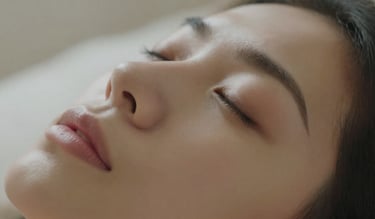 Person in hypnagogic threshold state between waking and sleep for subconscious reprogramming