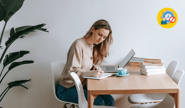 A woman sitting on her desk with a laptop and focus on her writing with a time blocking icon
