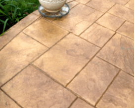 Spring Hill FL stamped concrete patio with a pot of plant decoration