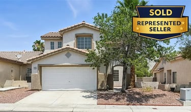 a sold sign for a home in the desert