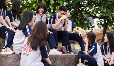 a group of young people sitting on steps