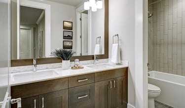 Glencoe master bath remodel with updated tile flooring, quartz countertops, and new fixtures