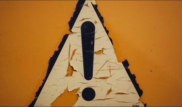 caution sign for gold IRA risks and considerations