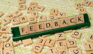 block letters spelling "feedback" for augusta precious metals reviews