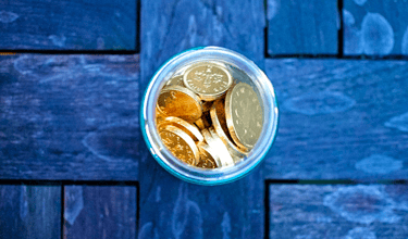 gold coins in glass for gold ira