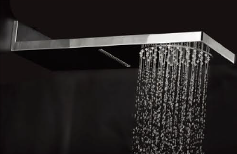 Modern wall-mounted chrome rain shower head with flowing water and sleek minimalist design.