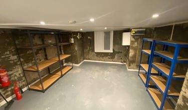 renovated cella with shelves and screeded floor carried out by general builds