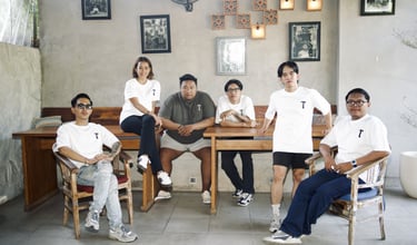 a group of people sitting around a table
