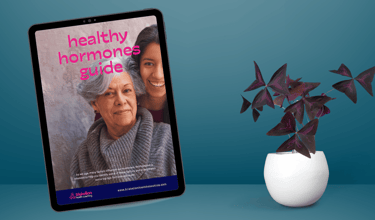 image of a ipad with the screen showing a healthy hormones guide and a plant next to the ipad.
