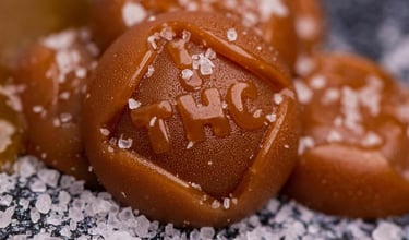Salted THC infused caramel candy edibles with coarse sea salt crystals for recreational cannabis use.