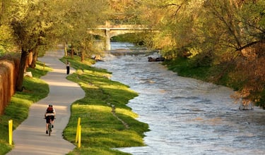 Cyclist and walker on the Los Angeles River Bike Path