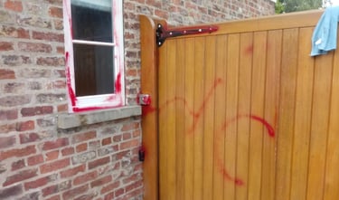 gate with graffiti