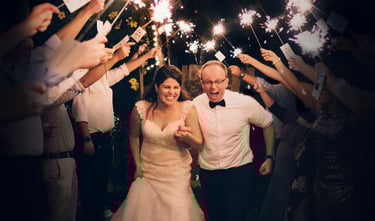 Glasgow wedding video—sparkler tunnel exit at night, candid moment.
