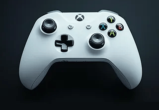 a white xbox controller controller with a controller