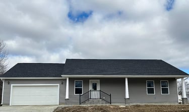 a house with a garage door and a garage door