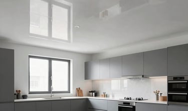 A complex multi-level ceiling with rectangular recessed panels glowing with warm yellow light.