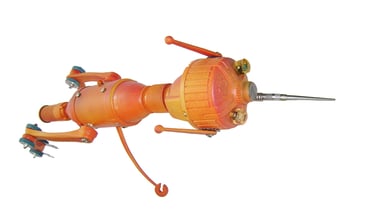 Orange metal creature sculpture named Needlenose by artist Tal Avitzur.